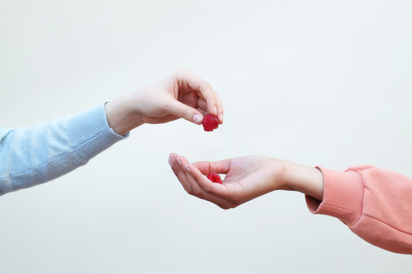 Hand Giving Raspberry